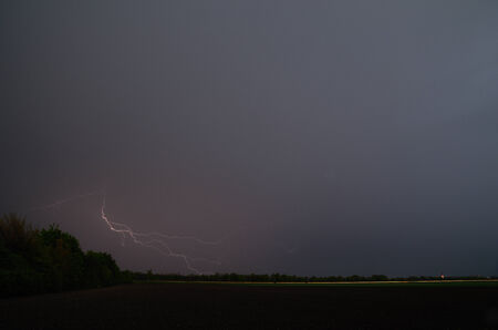 strong lightning at storm in the field