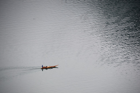 old antique wooden boat on a lakeの写真素材