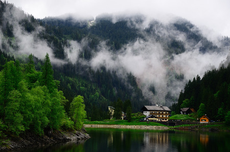 Beautiful lake and houses in the mountainsの写真素材