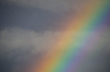 sky and colorful rainbow in summerの写真素材