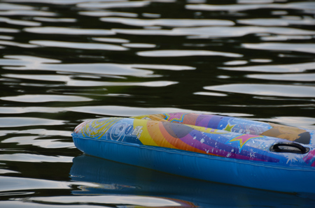 colorful inflatable mattress on the lake in summerの写真素材