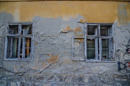 two windows in an old abandoned houseの写真素材
