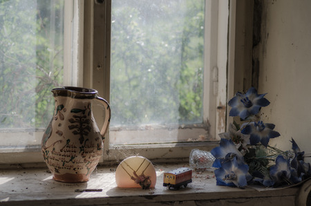 old things on a windowsill in a houseの写真素材