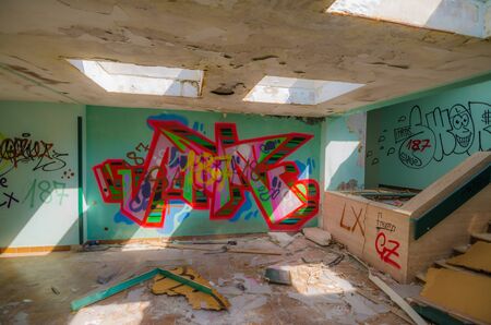 colorful graffiti in an old entrance hallのeditorial素材