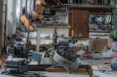 small machine on workbench in abandoned factory