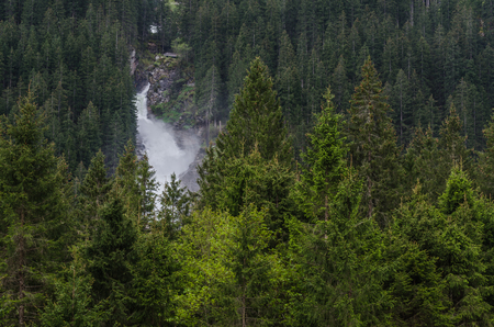 beautiful big waterfall with green forestの写真素材