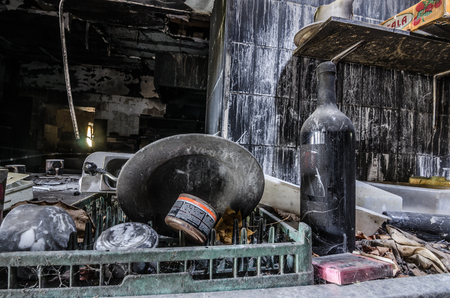 plate and bottle after a kitchen fire in houseの写真素材
