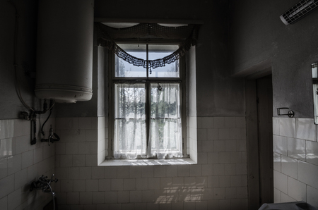 window with old white curtainの写真素材