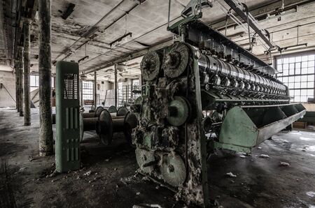 spinning factory and many old big machinesの写真素材