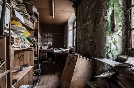 abandoned office with records in old factoryの写真素材