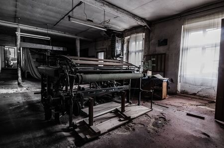 big old press in spinning factoryの写真素材