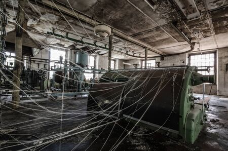 machine with many threads in old spinning millの写真素材