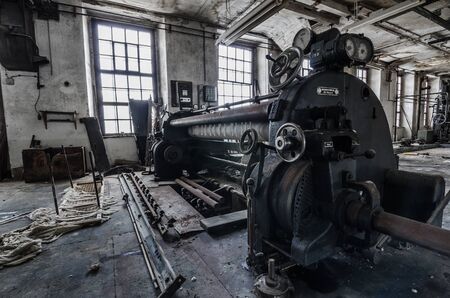 big old press in spinning factoryの写真素材
