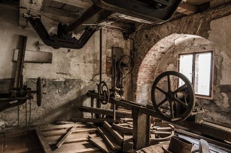 abandoned vaulted cellars with machines in a factoryの写真素材
