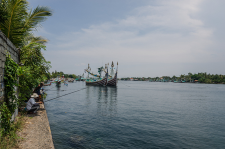 fishermen and colorful boats on the coastのeditorial素材