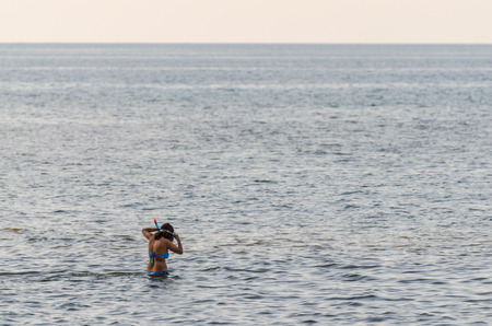 woman snorkeling in the sea and vacationの写真素材