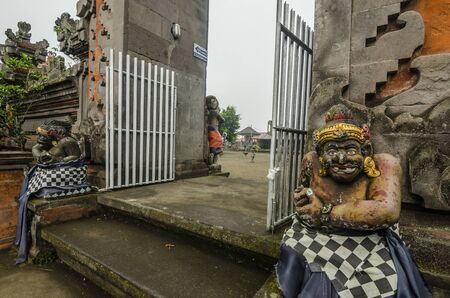 gate with statues of stone in a temple