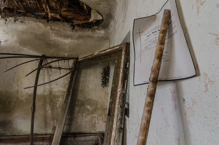death certificate on wall in old house in forestのeditorial素材