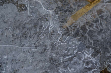 thin ice crystals on the stream in winter