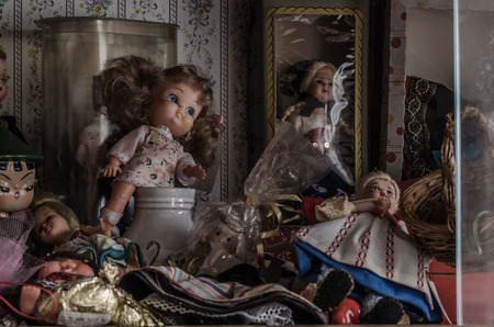 many dolls and vitrine in abandoned houseの写真素材