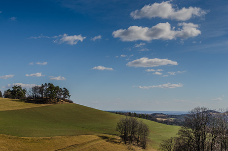 hill landscape with sky and cloudsの写真素材