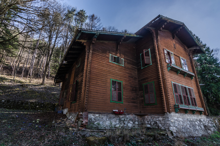 uninhabited old forest house on the mountainの写真素材