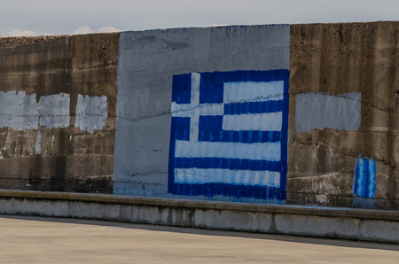 painted flag on a wall in greece