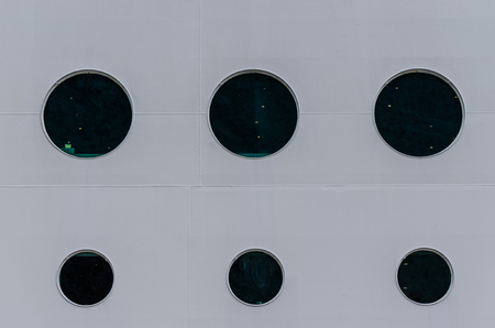 round window in ship in whiteの写真素材