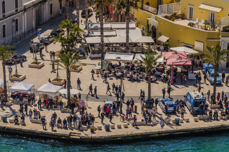 many people at the place in the harbor in Italyのeditorial素材