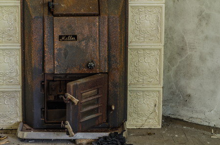 rusty stove in an old houseの写真素材