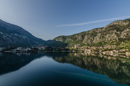 valley with city and reflection on the sea in Montenegroの写真素材