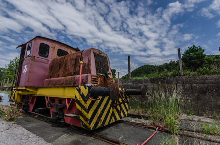 Rusty rail car on a terrain of a factoryの写真素材