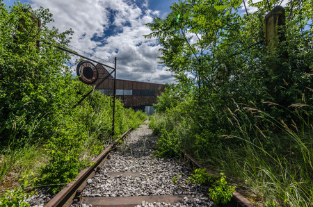 old rails and gate to a factoryの写真素材