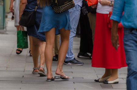 Woman with blue skirt in the city in summerの写真素材