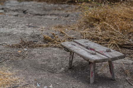 Stool made of wood in an old garden centerの写真素材