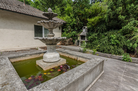Fountain at an old abandoned houseの写真素材