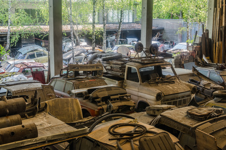 Many cars in a hall from a abandoned junkyardの写真素材