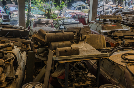 many cars on an old abandoned junkyardの写真素材