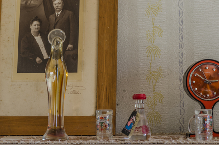Glass bottles and photo in an abandoned houseのeditorial素材