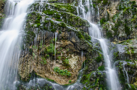 delicate veil waterfall in the mountains