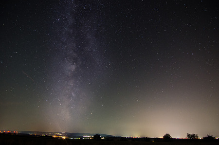 City with lights and milky way in the night