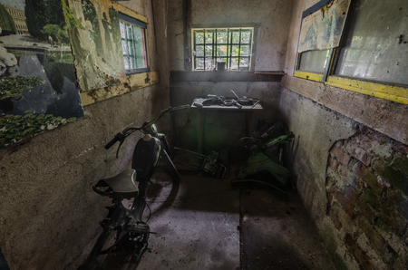 abandoned storeroom with motorcycleのeditorial素材
