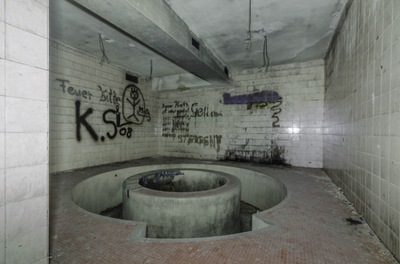 Basin in abandoned wellness area of a hotelの写真素材
