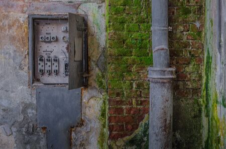 Electric box and green brick with moldの写真素材
