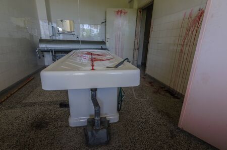 color on pathology table in abandoned hospital