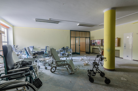 Many different wheelchairs in a deserted old hospitalのeditorial素材