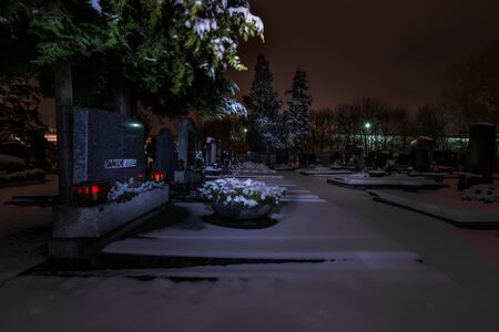 grave lights with grave and snow in winterの写真素材