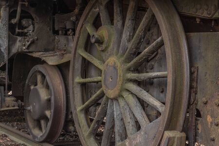 old locomotive and big wheels detail view