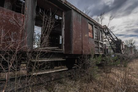 Open wagon of a rusty train in the natureの写真素材
