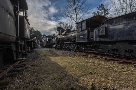 Old steam locomotive collecting point on a train cemeteryの写真素材